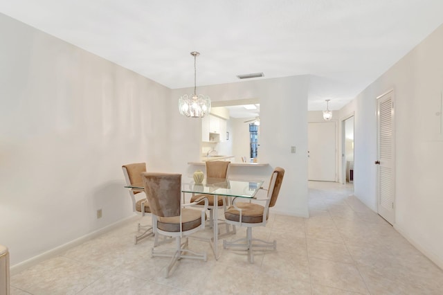 dining area featuring visible vents, baseboards, ceiling fan with notable chandelier, and light tile patterned floors