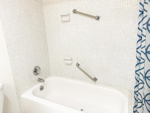 full bath featuring toilet and shower / bath combination with curtain