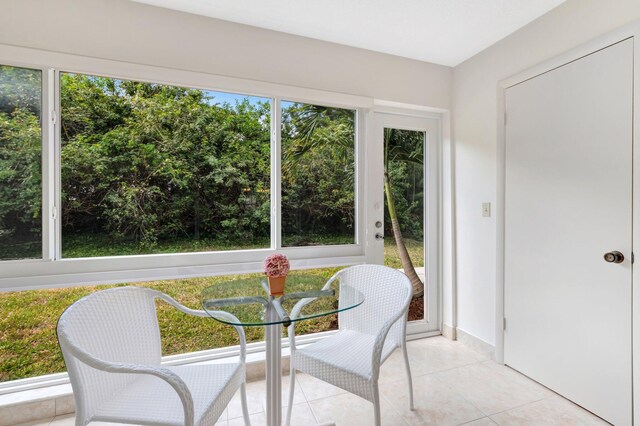 dining area featuring light tile patterned floors