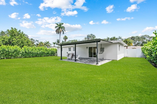1269 NW 4th St, Boca Raton, FL 33486 - rear view of property featuring stucco siding and a patio