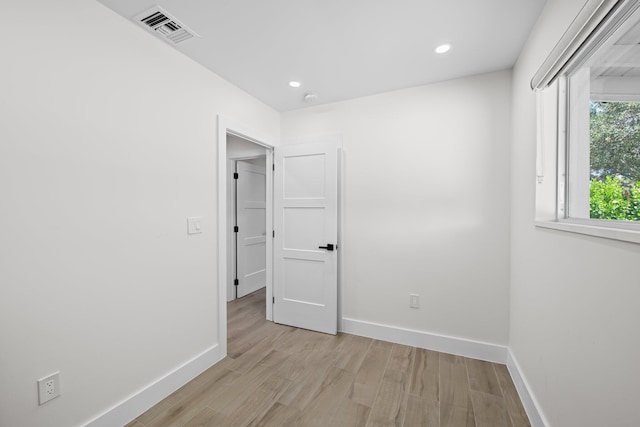 1269 NW 4th St, Boca Raton, FL 33486 - unfurnished room with light wood finished floors, baseboards, and recessed lighting