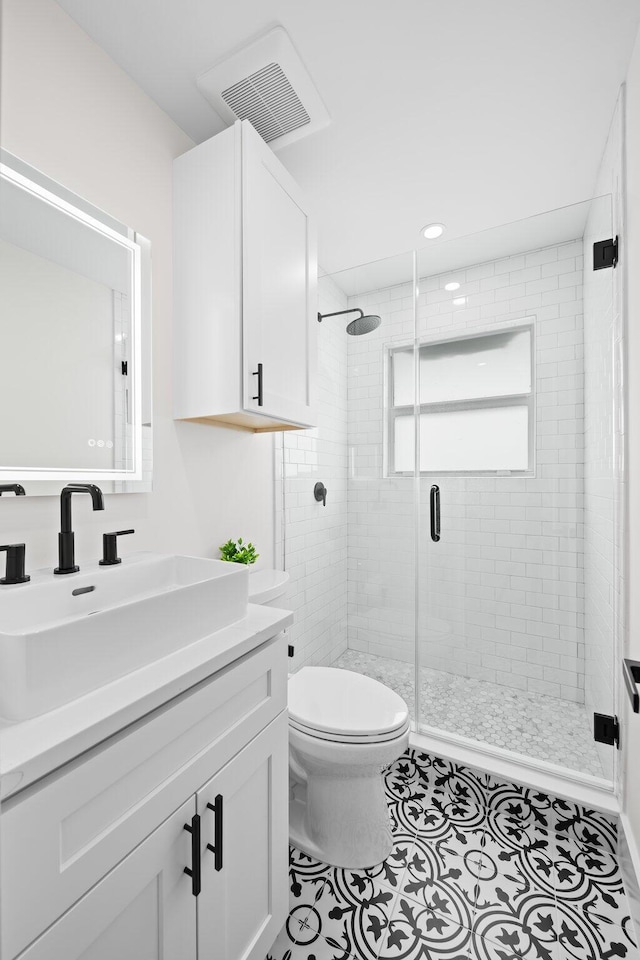 1269 NW 4th St, Boca Raton, FL 33486 - bathroom featuring toilet, a shower stall, vanity, tile patterned flooring, and recessed lighting