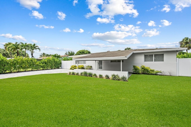 1269 NW 4th St, Boca Raton, FL 33486 - back of house with driveway and stucco siding