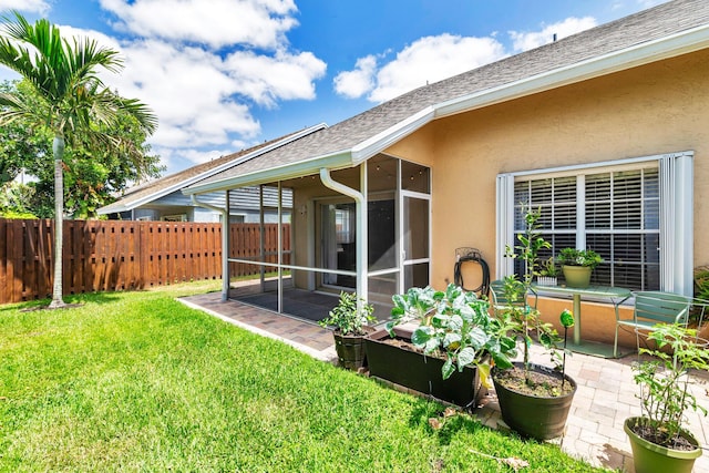 view of yard featuring fence and a patio area