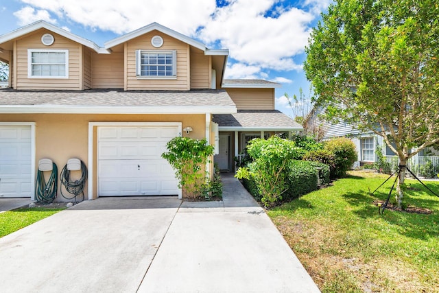 view of front of home featuring a garage, a front yard, roof with shingles, stucco siding, and concrete driveway