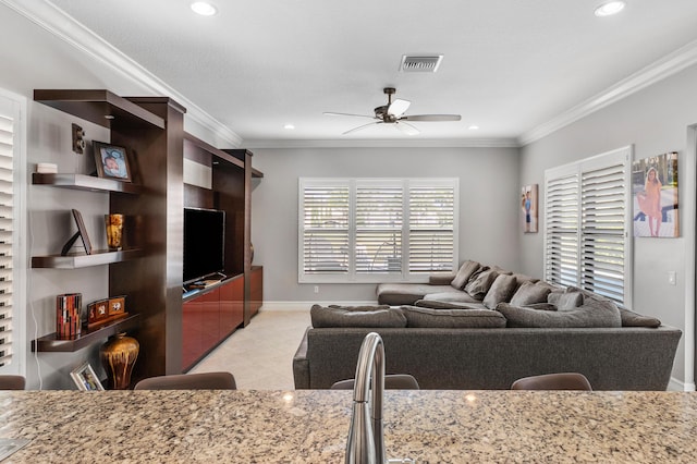living area with ornamental molding, a ceiling fan, recessed lighting, and light tile patterned flooring
