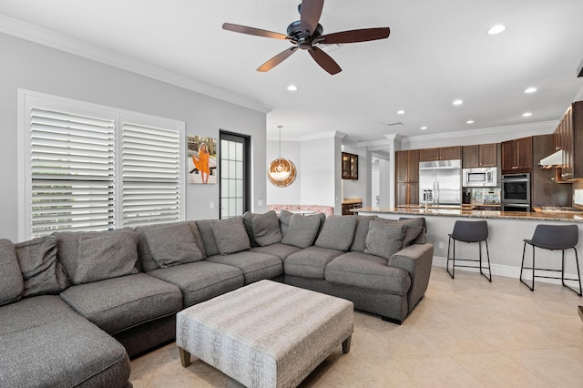 living room with recessed lighting, ceiling fan, ornamental molding, and plenty of natural light