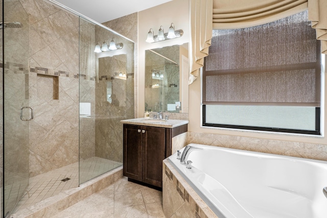 full bath with a shower stall, a bath, and vanity