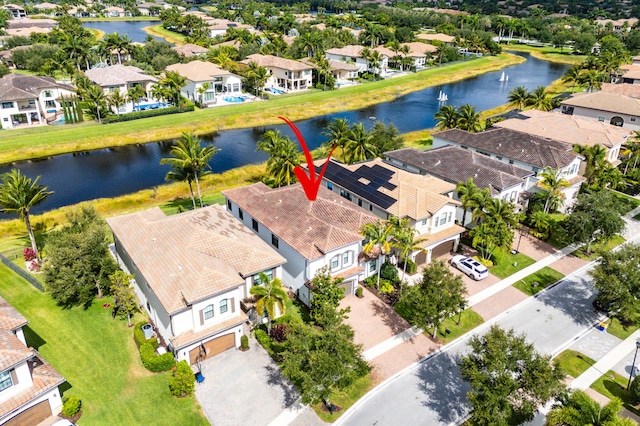 birds eye view of property featuring a residential view and a water view