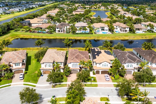 bird's eye view with a residential view and a water view