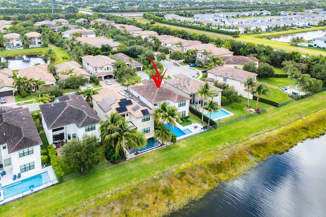 bird's eye view featuring a water view and a residential view