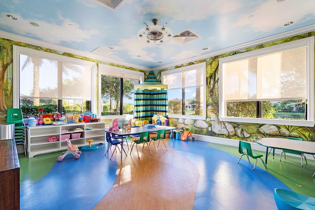 rec room featuring visible vents, ornamental molding, and concrete flooring