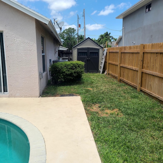 6374 Robinson St, Jupiter, FL 33458 - view of yard featuring fence, a shed, an outbuilding, and a patio area