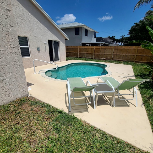 6374 Robinson St, Jupiter, FL 33458 - view of swimming pool featuring a patio, a fenced in pool, and a fenced backyard