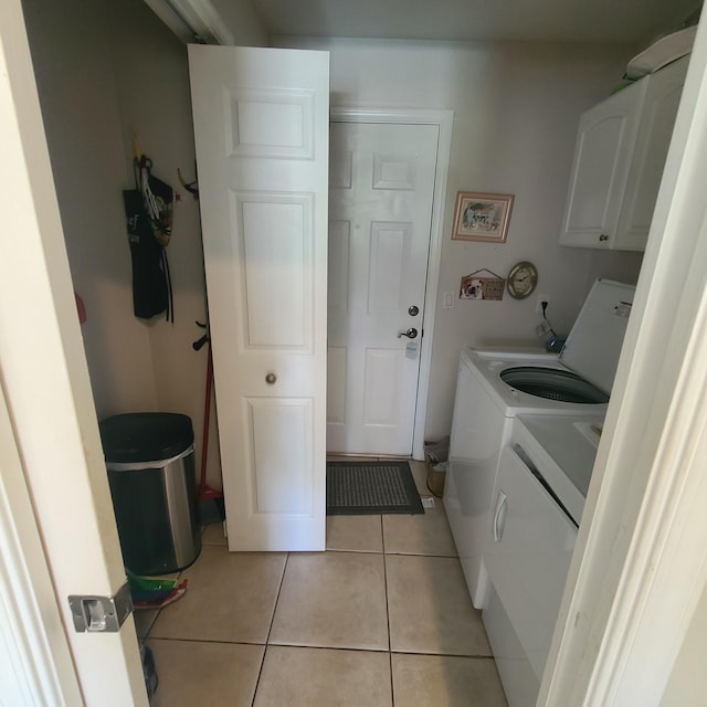 6374 Robinson St, Jupiter, FL 33458 - laundry room with light tile patterned floors, washing machine and dryer, and cabinet space