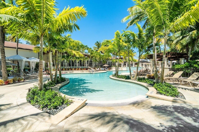 community pool with a patio area