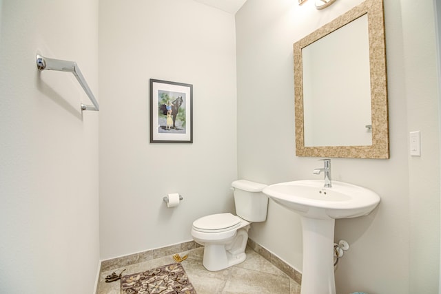 15688 Italian Cypress Way, Wellington, FL 33414 - half bathroom with baseboards, tile patterned flooring, and toilet