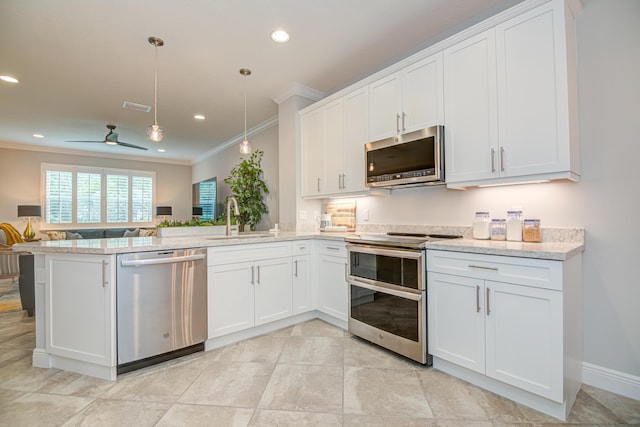 15688 Italian Cypress Way, Wellington, FL 33414 - kitchen featuring crown molding, appliances with stainless steel finishes, a sink, a peninsula, and open floor plan