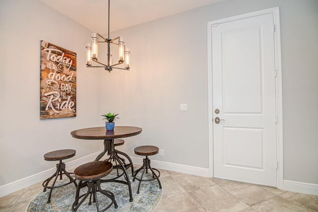 15688 Italian Cypress Way, Wellington, FL 33414 - dining room with light tile patterned floors, baseboards, and a notable chandelier
