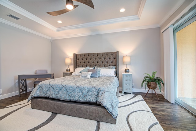 15688 Italian Cypress Way, Wellington, FL 33414 - bedroom with visible vents, baseboards, wood finished floors, and a tray ceiling