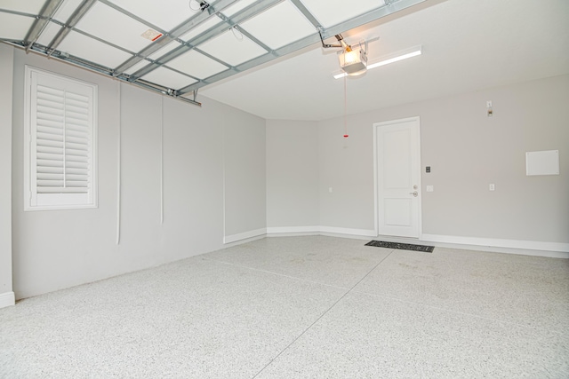15688 Italian Cypress Way, Wellington, FL 33414 - garage with baseboards and a garage door opener