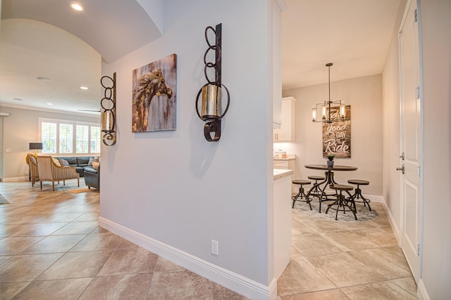 15688 Italian Cypress Way, Wellington, FL 33414 - hall with baseboards, recessed lighting, and a chandelier