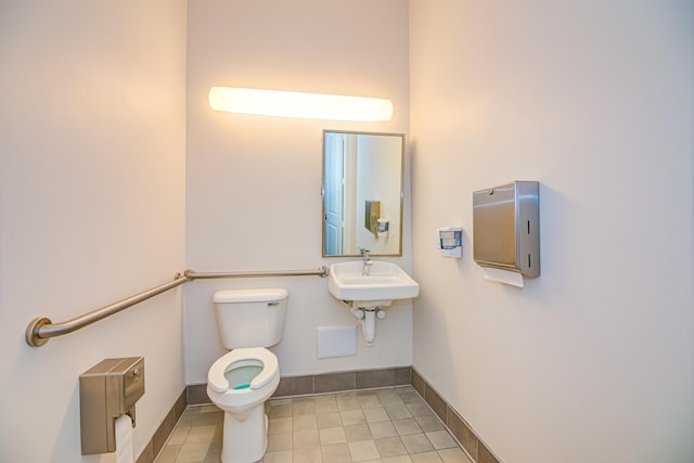 15688 Italian Cypress Way, Wellington, FL 33414 - bathroom with baseboards, a sink, tile patterned flooring, and toilet