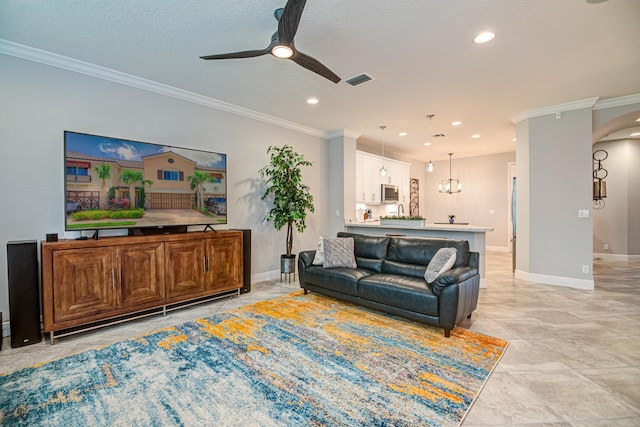 15688 Italian Cypress Way, Wellington, FL 33414 - living area featuring ceiling fan, crown molding, arched walkways, baseboards, and recessed lighting