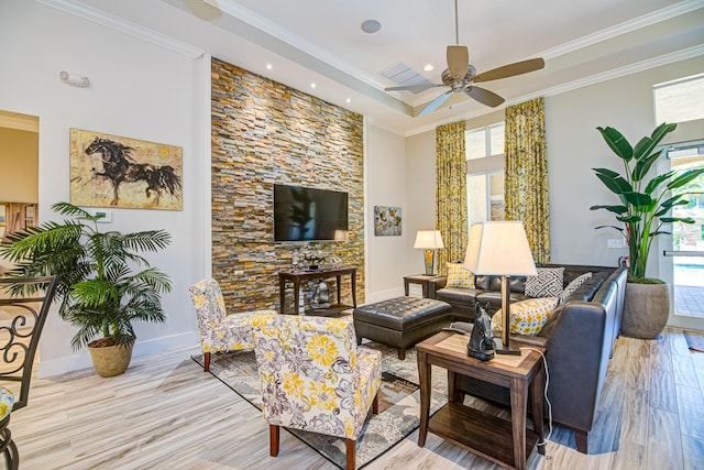 15688 Italian Cypress Way, Wellington, FL 33414 - living room with crown molding, a raised ceiling, a ceiling fan, recessed lighting, and wood finished floors