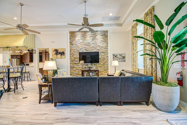 15688 Italian Cypress Way, Wellington, FL 33414 - living room featuring crown molding, a fireplace, a ceiling fan, recessed lighting, and visible vents
