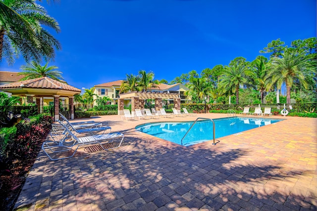 15688 Italian Cypress Way, Wellington, FL 33414 - pool with a patio, fence, and a pergola