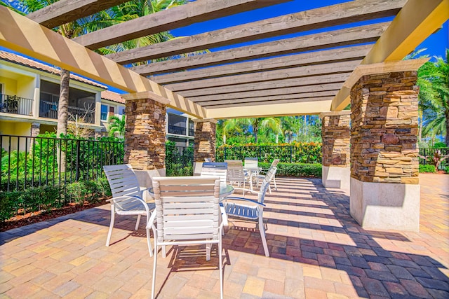 15688 Italian Cypress Way, Wellington, FL 33414 - view of patio / terrace featuring fence, outdoor dining space, and a pergola