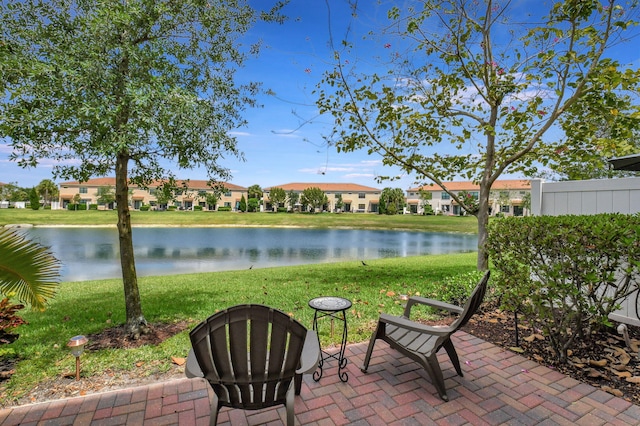 view of patio with a water view and a residential view