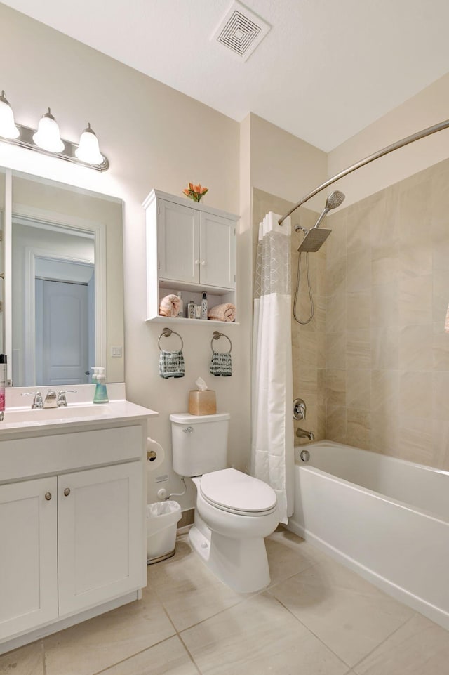bathroom featuring visible vents, tile patterned flooring, vanity, toilet, and shower / tub combo with curtain