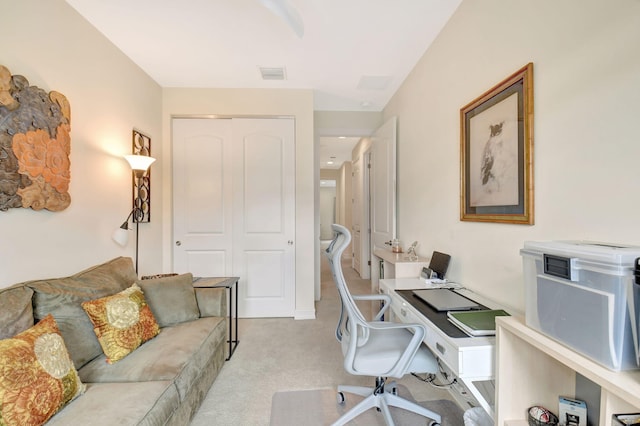 office featuring visible vents and light colored carpet
