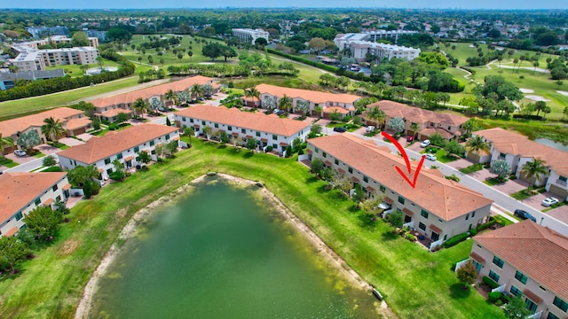 aerial view featuring view of golf course and a water view