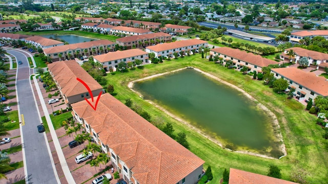 drone / aerial view with a water view