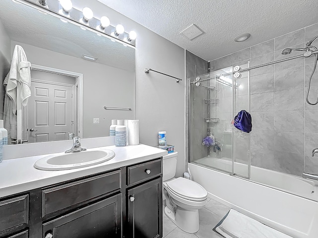 1679 SW Cameo Blvd, Port Saint Lucie, FL 34953 - bathroom featuring enclosed tub / shower combo, visible vents, toilet, vanity, and a textured ceiling