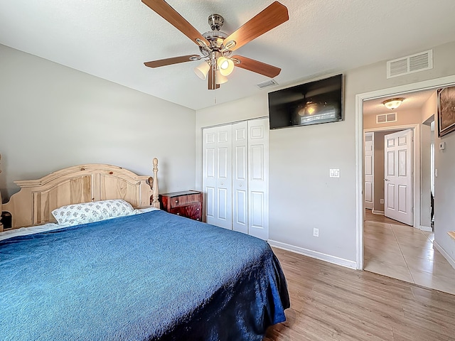 1679 SW Cameo Blvd, Port Saint Lucie, FL 34953 - bedroom featuring baseboards, light wood-style floors, and visible vents