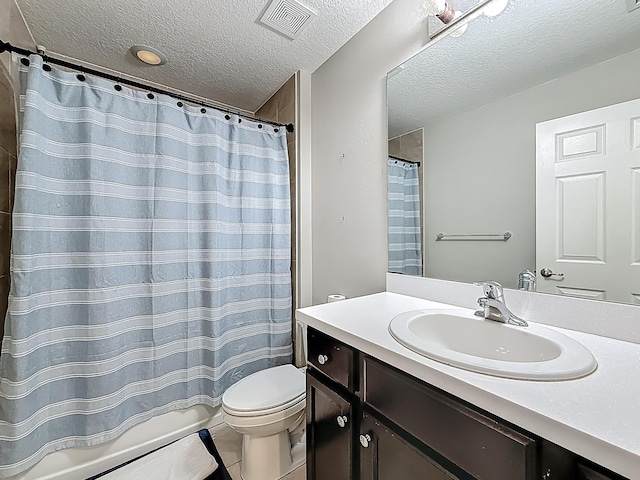 1679 SW Cameo Blvd, Port Saint Lucie, FL 34953 - bathroom with a textured ceiling, toilet, vanity, and visible vents