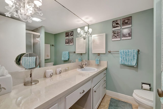 bathroom with baseboards, a shower stall, toilet, and a chandelier