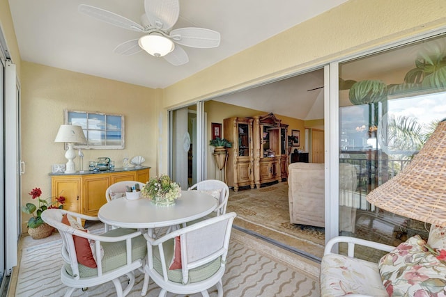 dining space with a ceiling fan