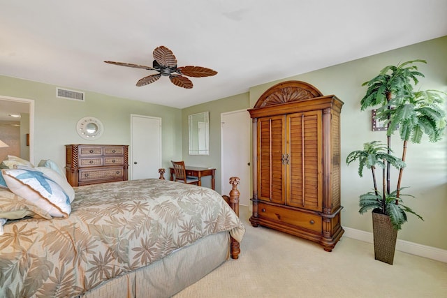 bedroom with a ceiling fan, baseboards, visible vents, and light carpet