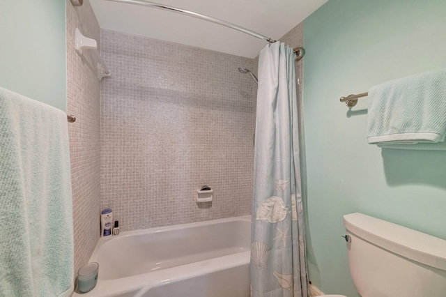 full bath featuring shower / bath combination with curtain and toilet