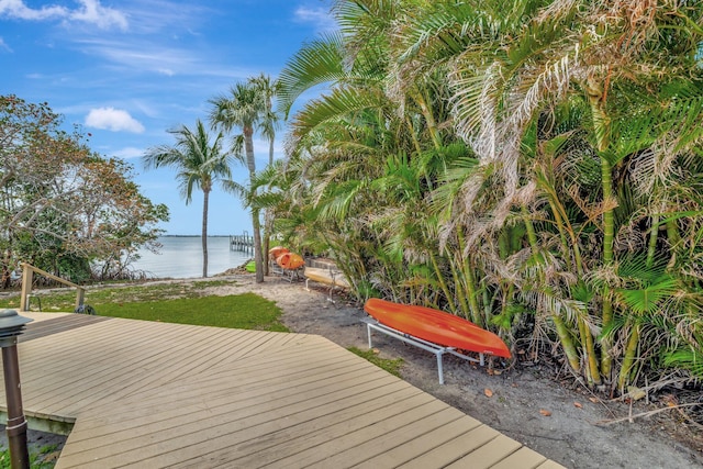 wooden deck with a water view