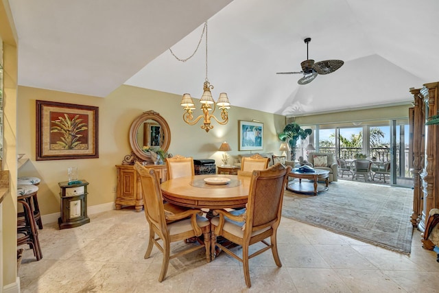 dining area featuring ceiling fan with notable chandelier, baseboards, and vaulted ceiling
