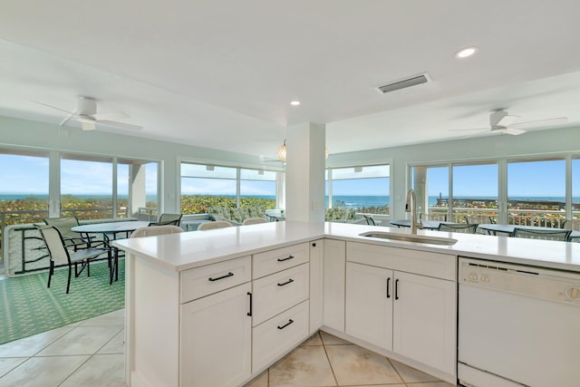 kitchen featuring ceiling fan, visible vents, a sink, and dishwasher