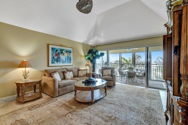 living area with high vaulted ceiling