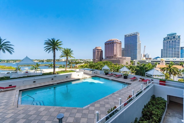 pool with a view of city and a water view