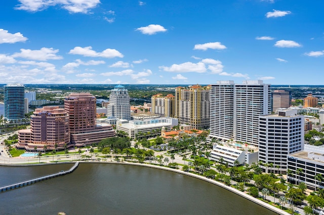 birds eye view of property featuring a view of city and a water view